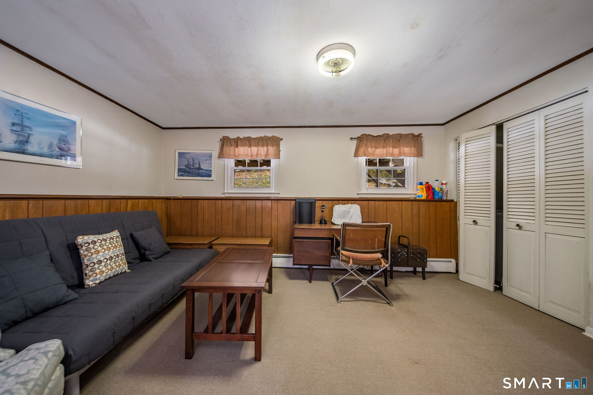 162 Yankee Peddler Path Madison, CT 06443 - Photo 25 of 39 a living room with furniture and a window