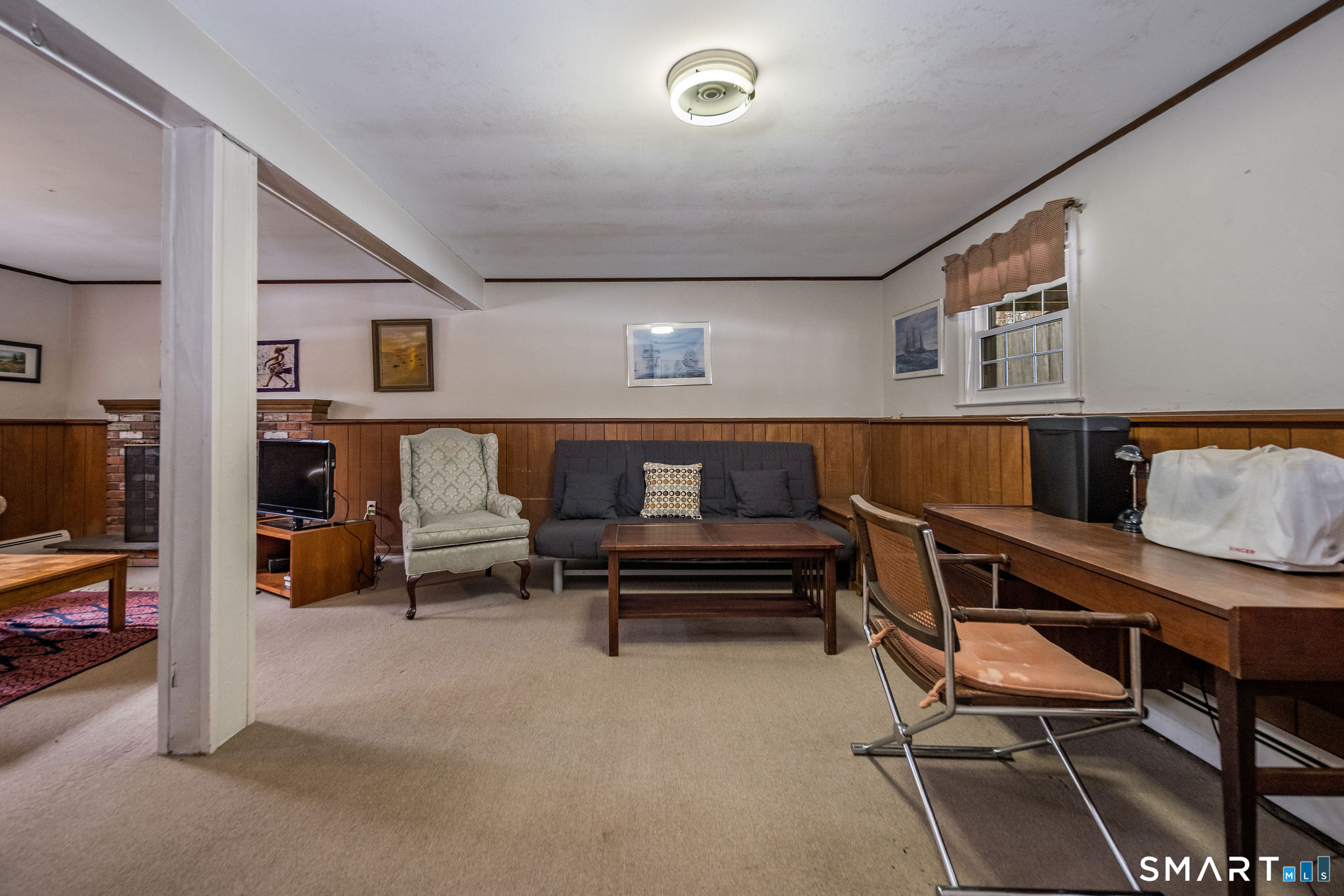162 Yankee Peddler Path Madison, CT 06443 - Photo 26 of 39 a living room with furniture and a flat screen tv