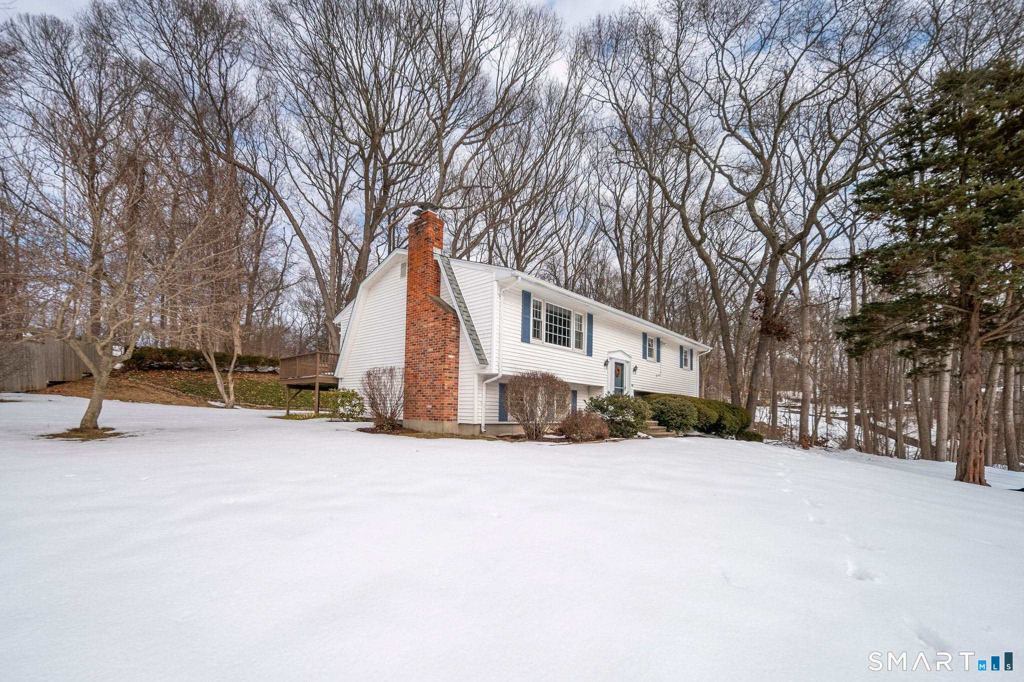 162 Yankee Peddler Path Madison, CT 06443 - Photo 32 of 39 a view of a house with a snow in yard