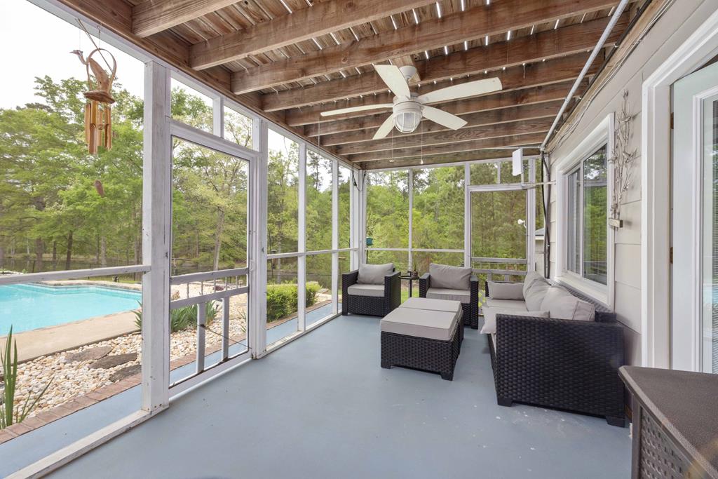520 Terry Lane Fortson, GA 31808 - Photo 13 of 52 a living room with furniture and a floor to ceiling window