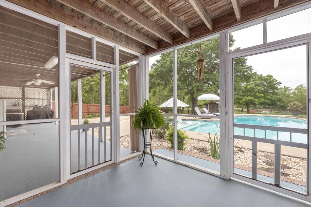 520 Terry Lane Fortson, GA 31808 - Photo 14 of 52 a view of a porch with furniture and floor to ceiling window