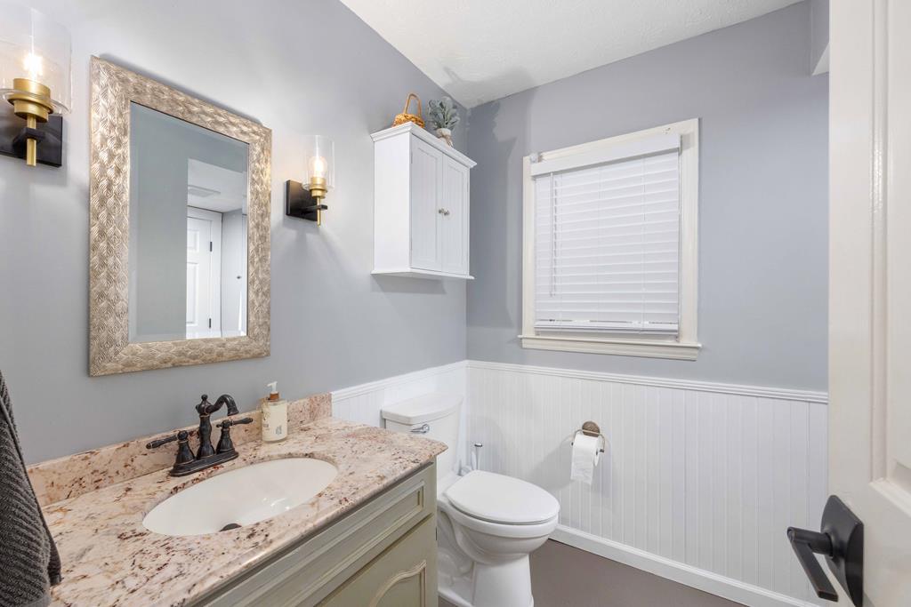 520 Terry Lane Fortson, GA 31808 - Photo 17 of 52 a bathroom with a granite countertop sink mirror vanity and toilet