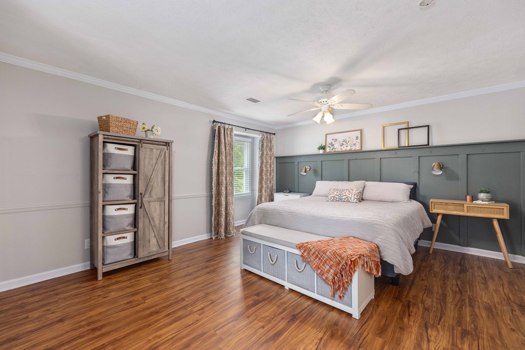 520 Terry Lane Fortson, GA 31808 - Photo 19 of 52 a bedroom with a bed and wooden floor