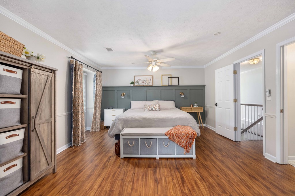 520 Terry Lane Fortson, GA 31808 - Photo 20 of 52 a bedroom with a bed and wooden floor