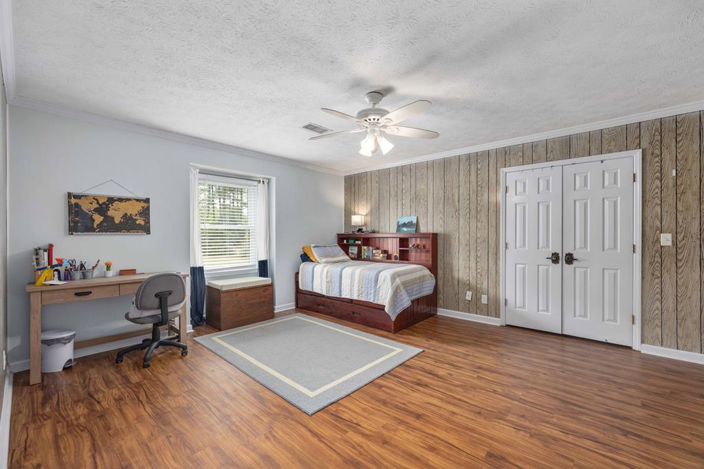 520 Terry Lane Fortson, GA 31808 - Photo 22 of 52 a bedroom with a bed and a window