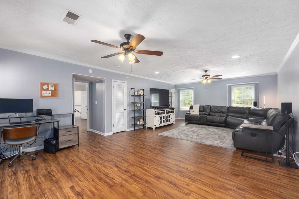 520 Terry Lane Fortson, GA 31808 - Photo 25 of 52 a living room with furniture and a wooden floor