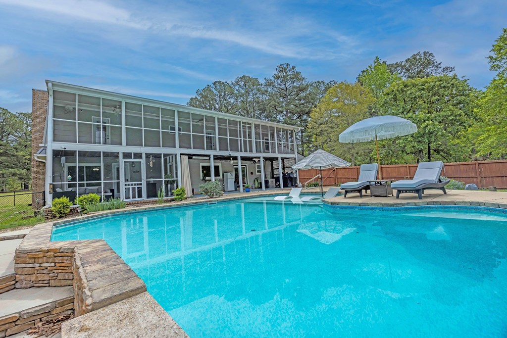520 Terry Lane Fortson, GA 31808 - Photo 32 of 52 a view of a swimming pool with a lounge chair