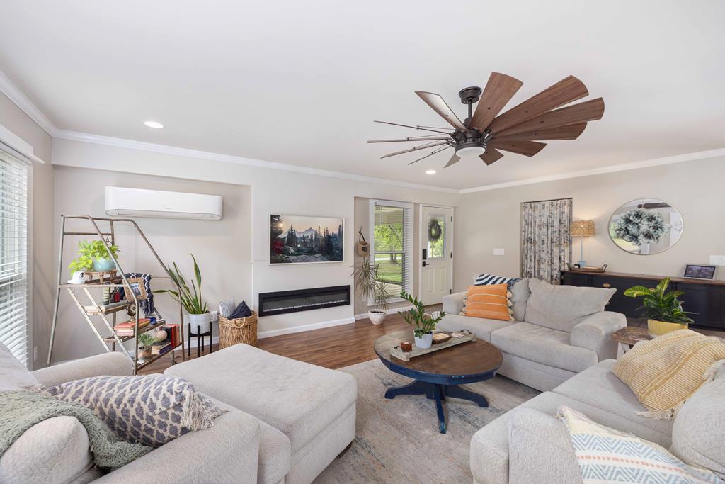 520 Terry Lane Fortson, GA 31808 - Photo 4 of 52 a living room with furniture a rug and a flat screen tv