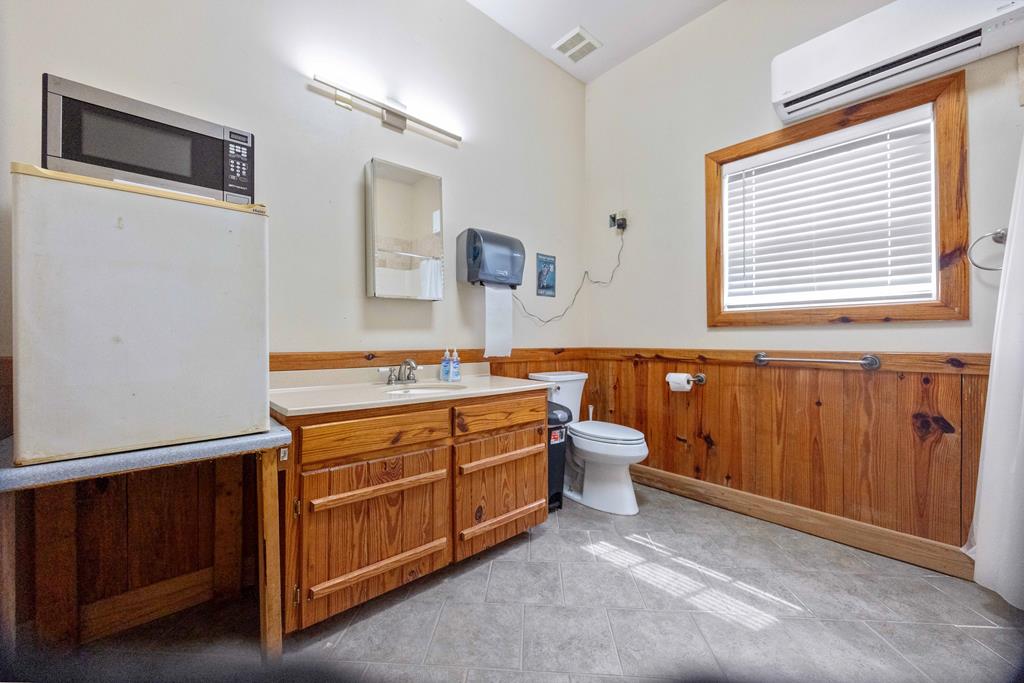520 Terry Lane Fortson, GA 31808 - Photo 42 of 52 a bathroom with a sink a toilet and mirror