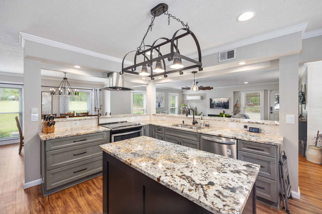 520 Terry Lane Fortson, GA 31808 - Photo 6 of 52 a kitchen with stainless steel appliances granite countertop a stove and cabinets