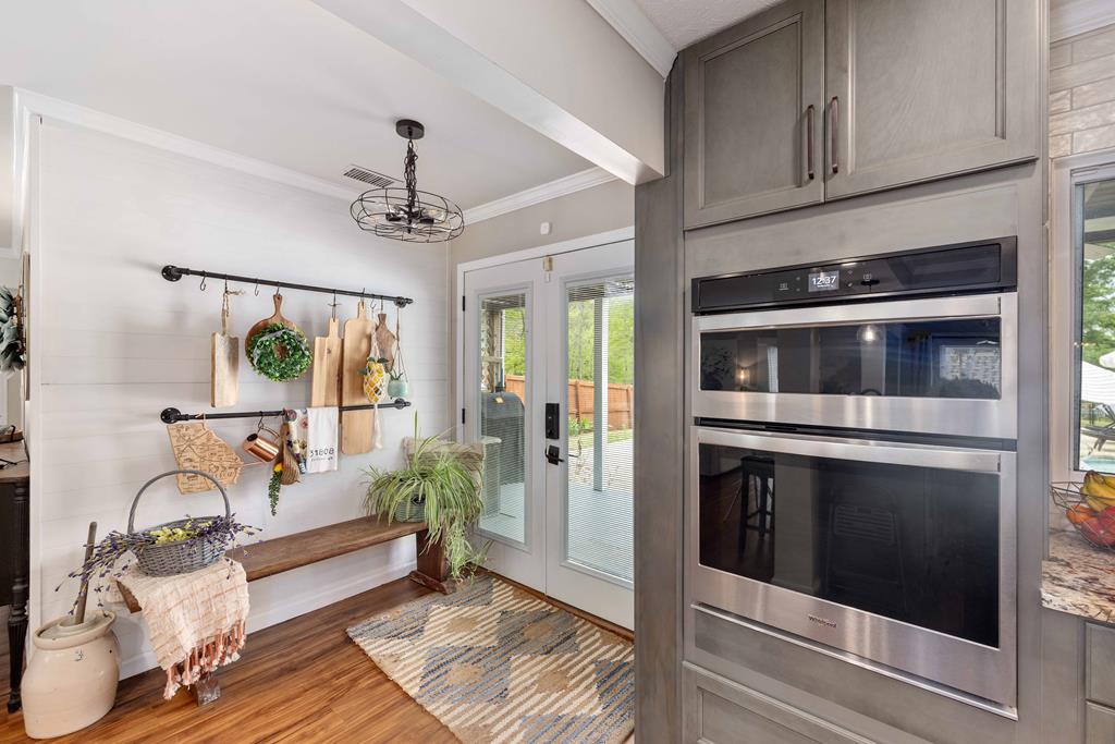 520 Terry Lane Fortson, GA 31808 - Photo 7 of 52 a living room with stainless steel appliances kitchen island granite countertop a stove and a wooden floors