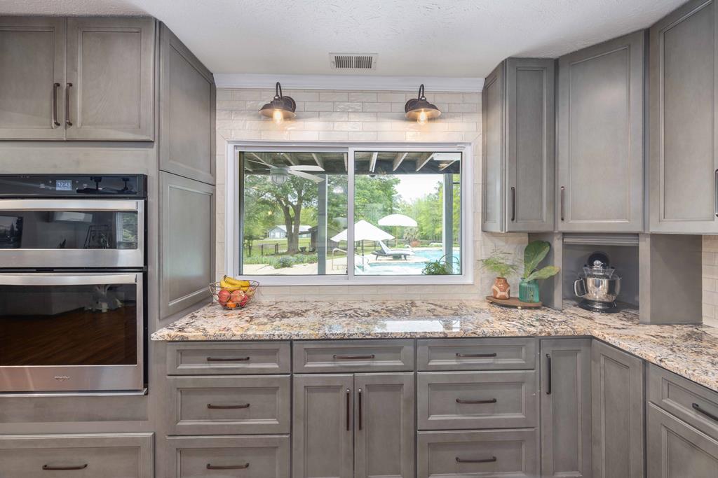 520 Terry Lane Fortson, GA 31808 - Photo 8 of 52 a kitchen with granite countertop white cabinets and a window