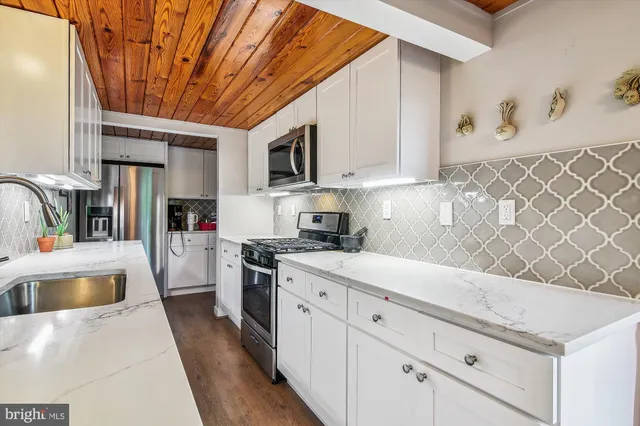 a kitchen with a sink and cabinets