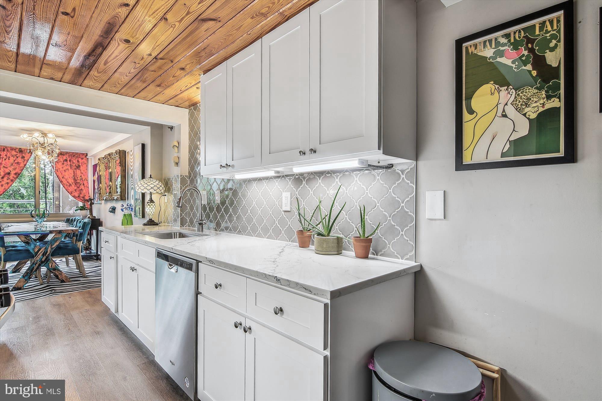 2901 Boston Street, Unit 206 Baltimore, MD 21224 - Photo 17 of 65 a kitchen with a sink and cabinets