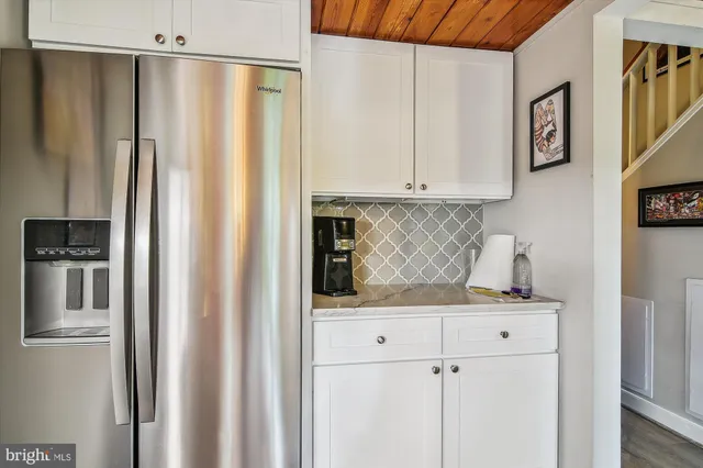a bedroom with a bed window and walk in closet