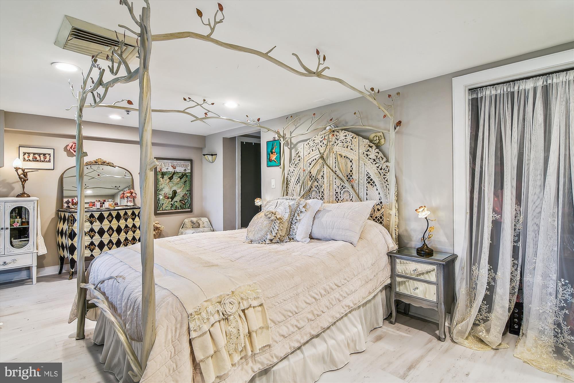 2901 Boston Street, Unit 206 Baltimore, MD 21224 - Photo 23 of 65 a bedroom with a bed window and walk in closet