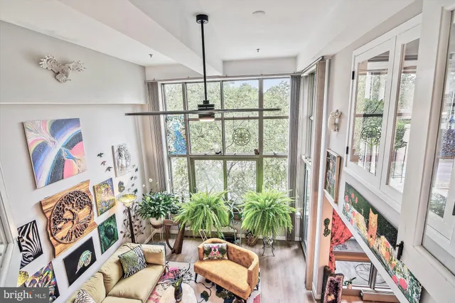 a view of a hallway with windows and stairs
