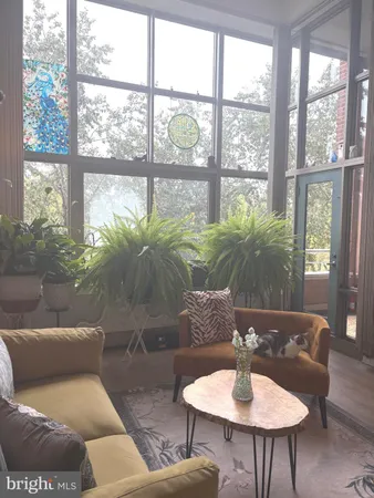 a workspace with furniture window and wooden floor
