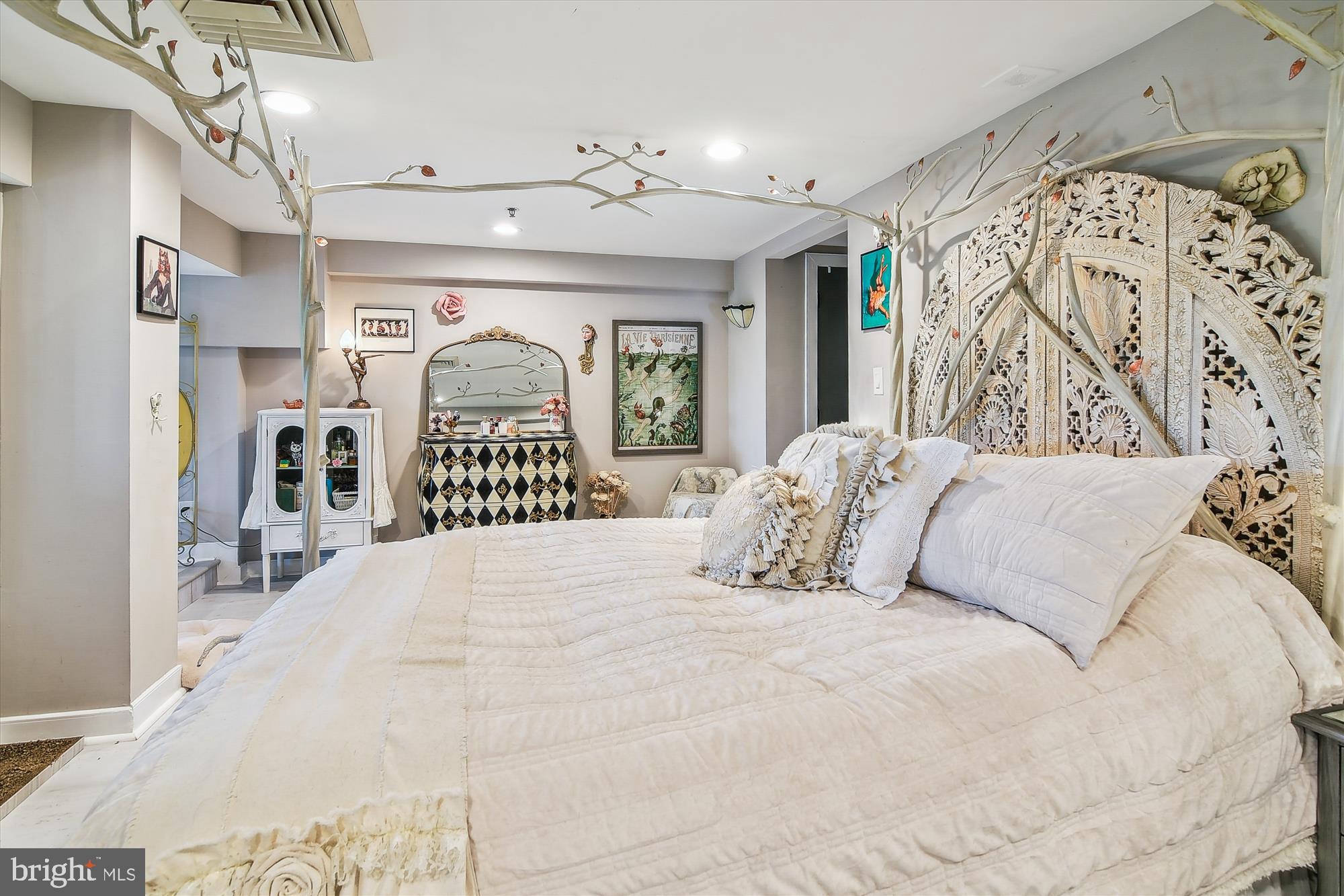 2901 Boston Street, Unit 206 Baltimore, MD 21224 - Photo 30 of 65 a large bed with a large mirror next to a window