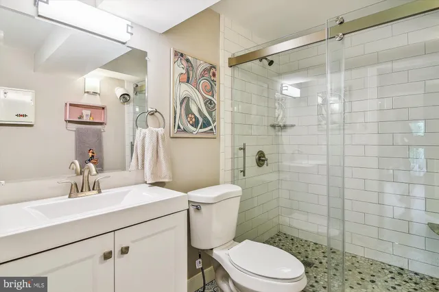 a view of a dining room with furniture and a chandelier