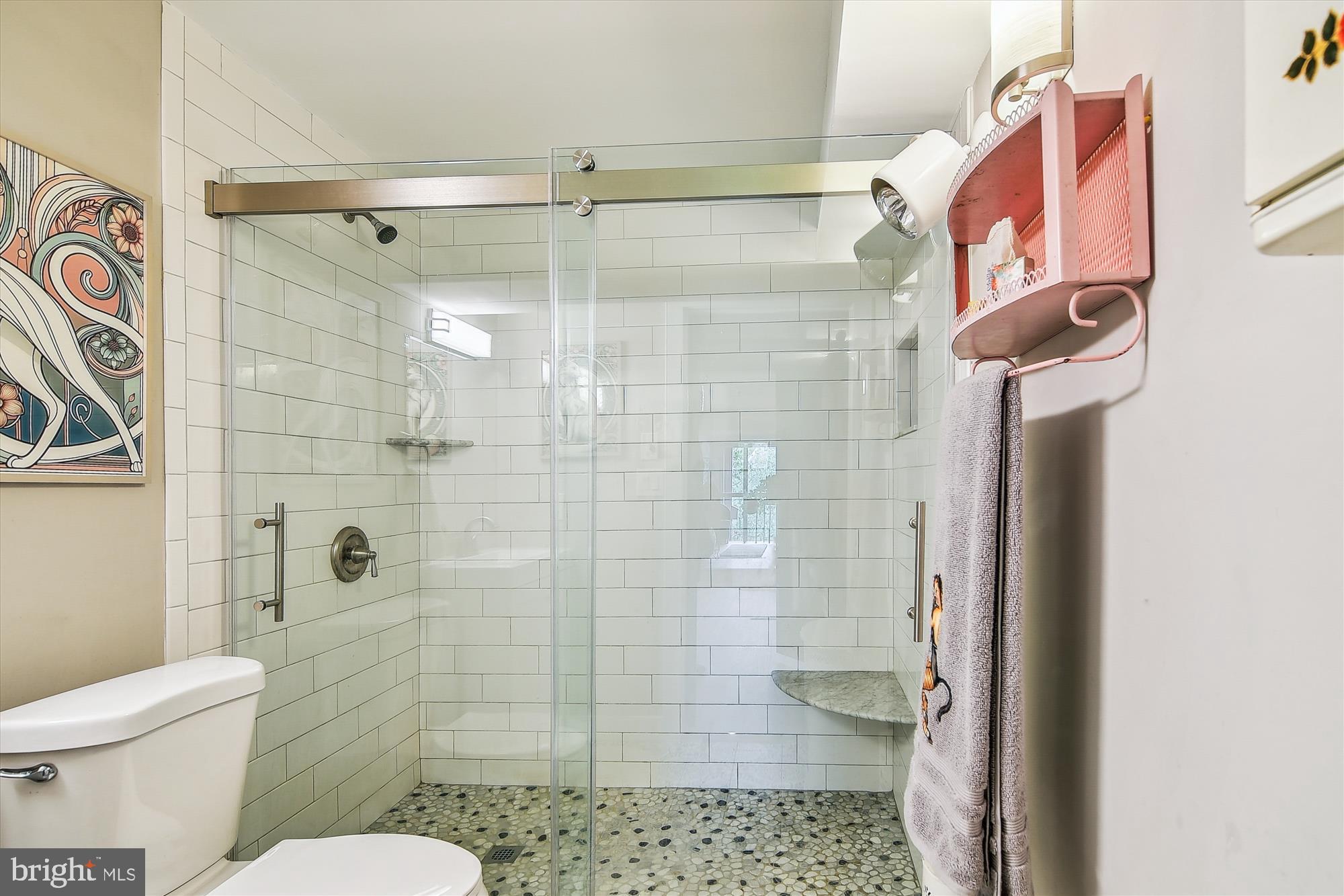 2901 Boston Street, Unit 206 Baltimore, MD 21224 - Photo 33 of 65 a bathroom with a toilet and shower