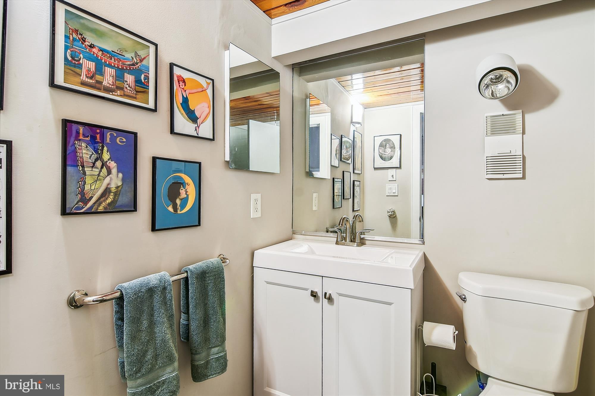 2901 Boston Street, Unit 206 Baltimore, MD 21224 - Photo 36 of 65 a bathroom with a sink and a mirror