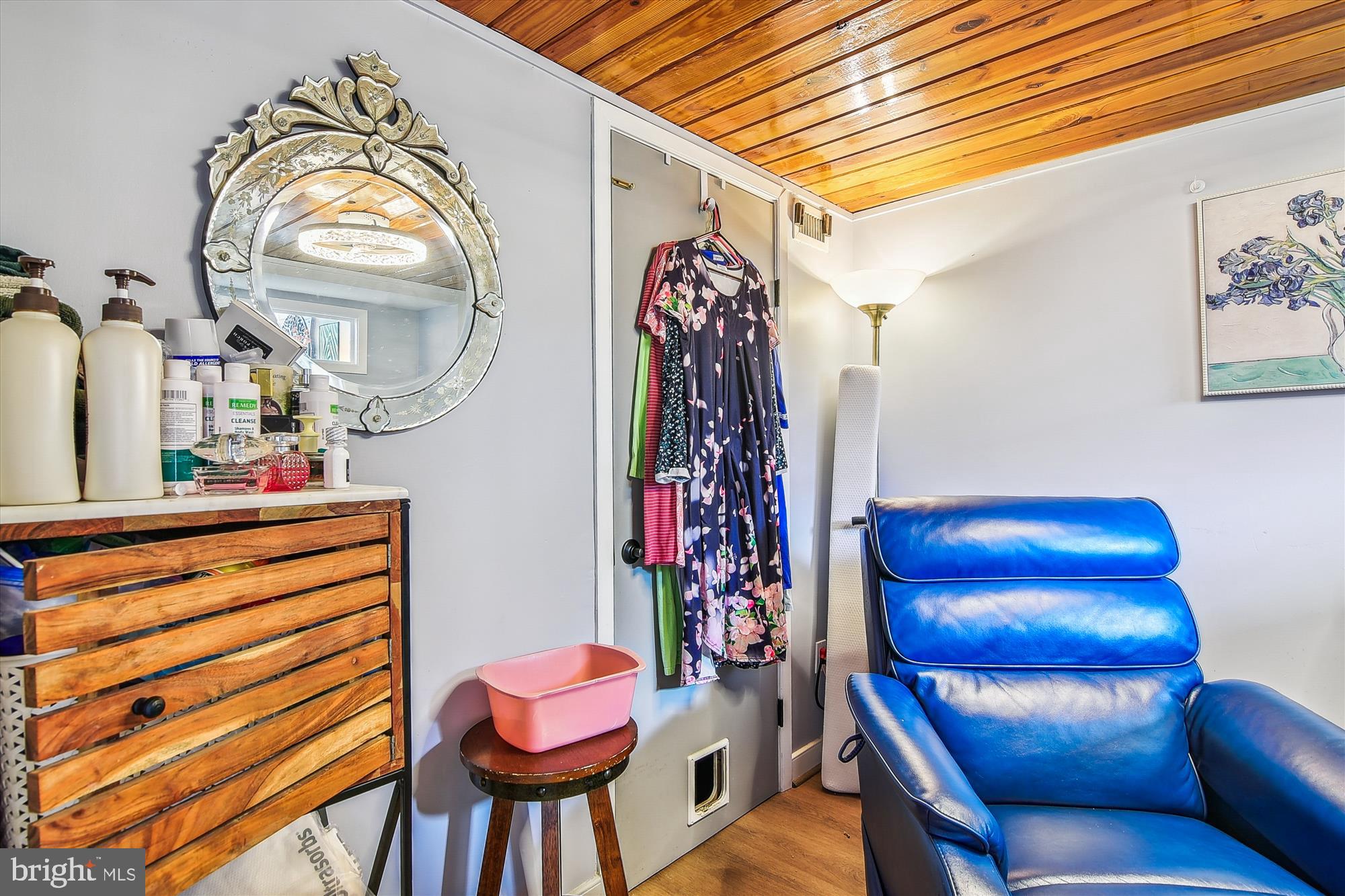 2901 Boston Street, Unit 206 Baltimore, MD 21224 - Photo 39 of 65 a view of a dining room with furniture and a chandelier