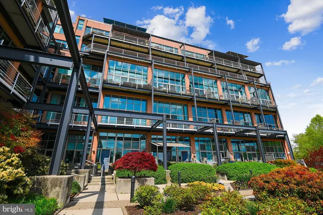 a view of swimming pool with outdoor seating and city view