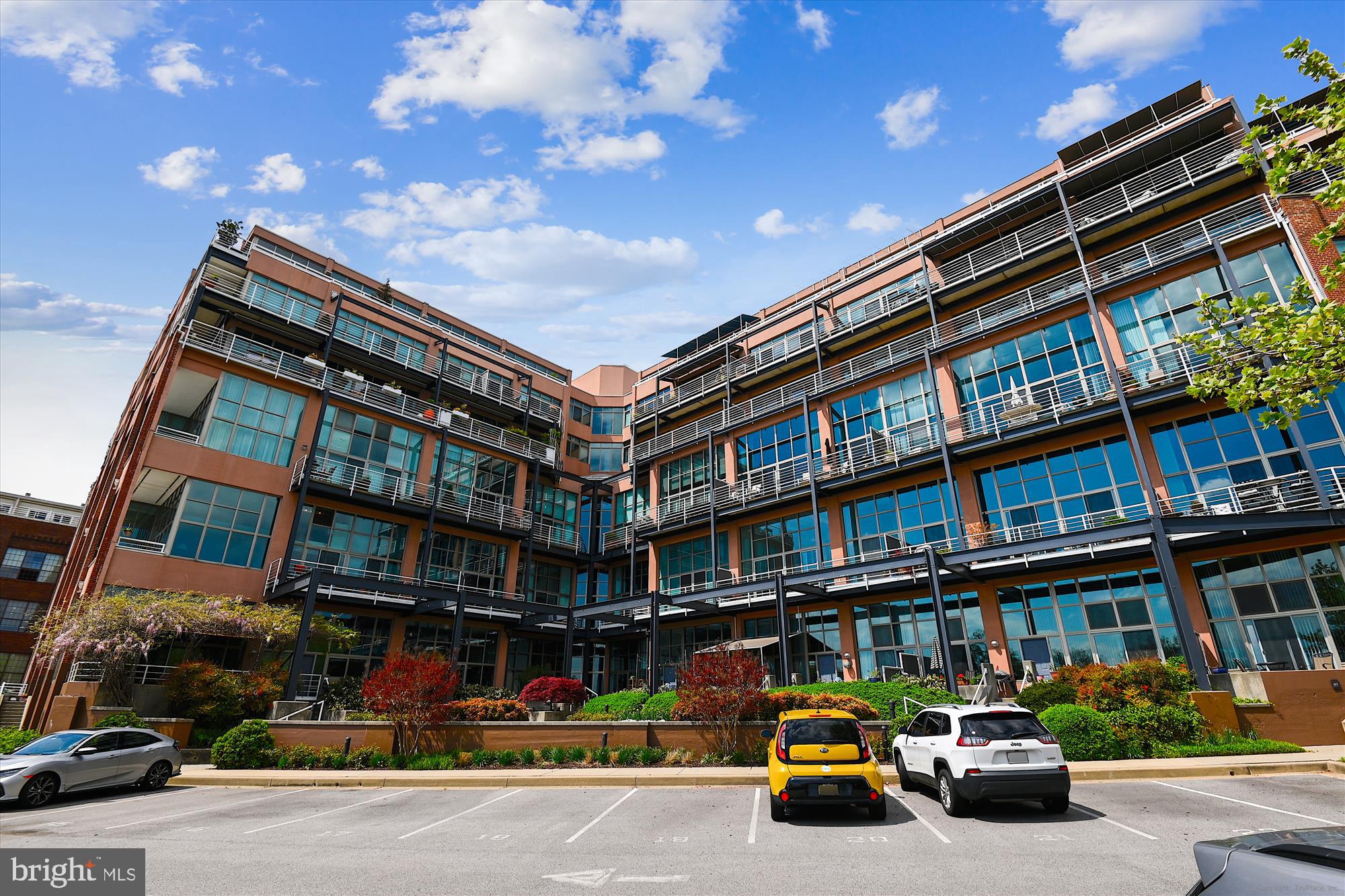 2901 Boston Street, Unit 206 Baltimore, MD 21224 - Photo 50 of 65 a car parked in front of a building
