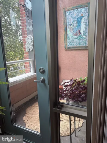 a view of a dining room with furniture large windows and wooden floor