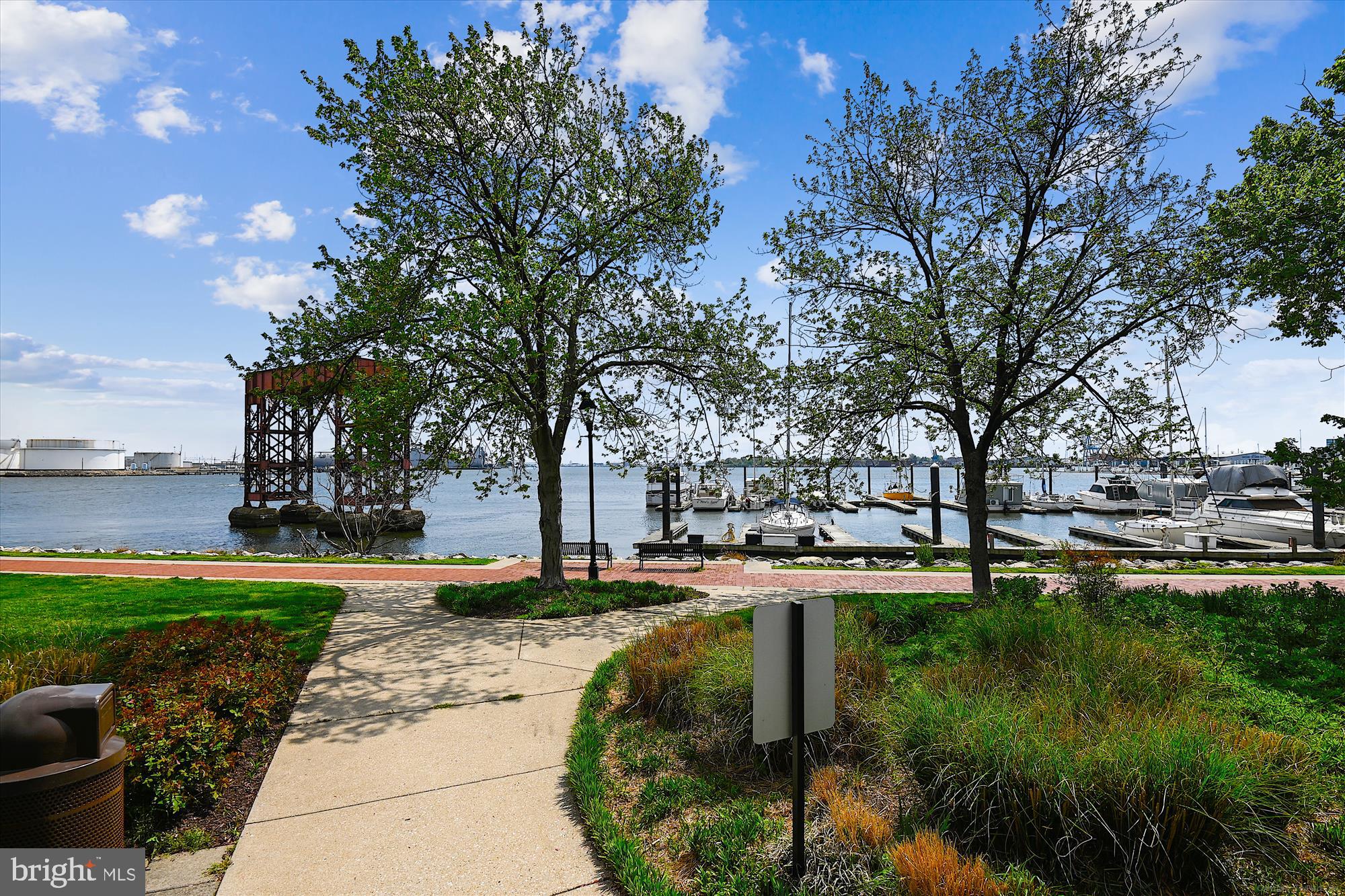 2901 Boston Street, Unit 206 Baltimore, MD 21224 - Photo 54 of 65 a backyard of a house with lots of green space and fountain