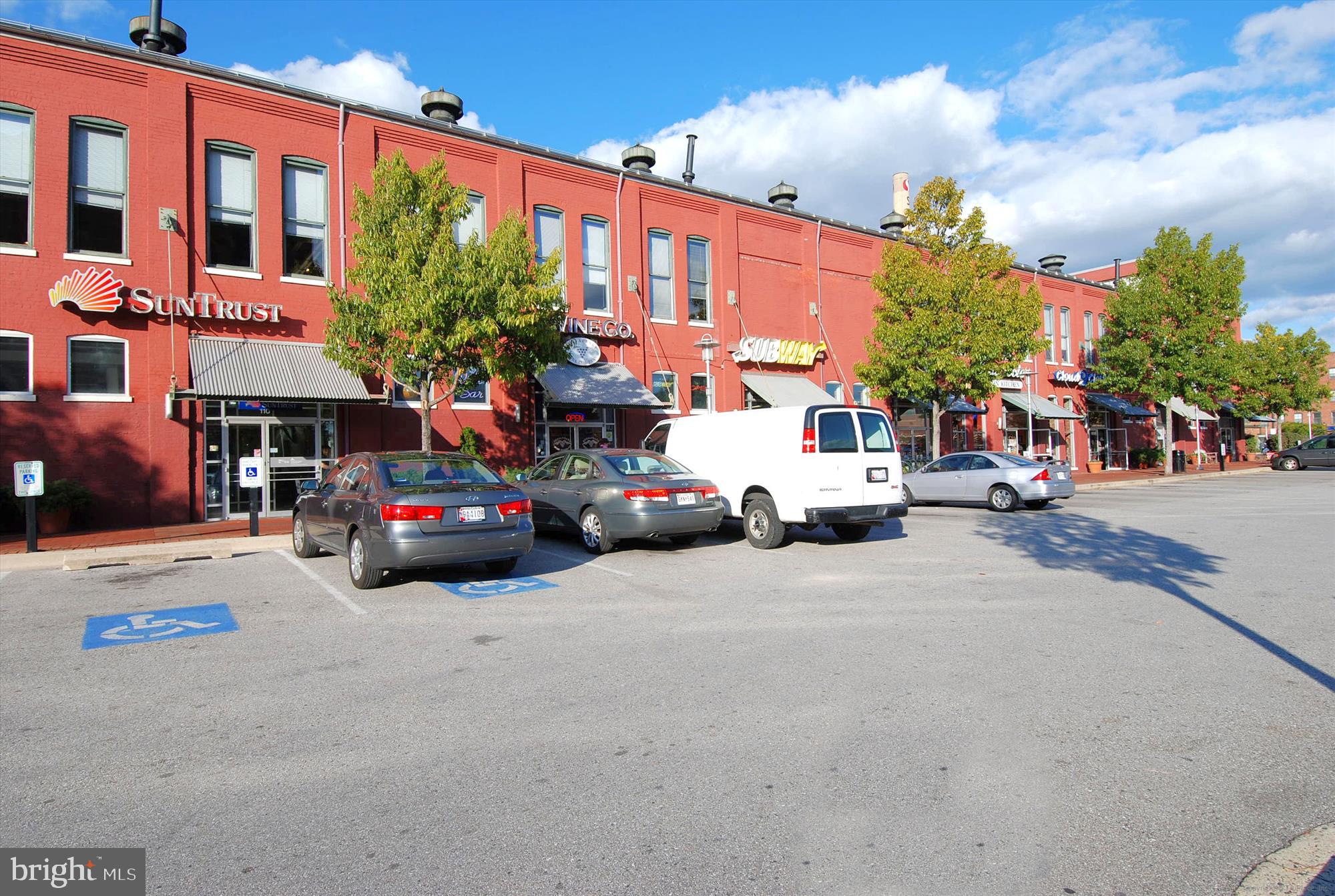 2901 Boston Street, Unit 206 Baltimore, MD 21224 - Photo 64 of 65 a view of a city street with parked cars