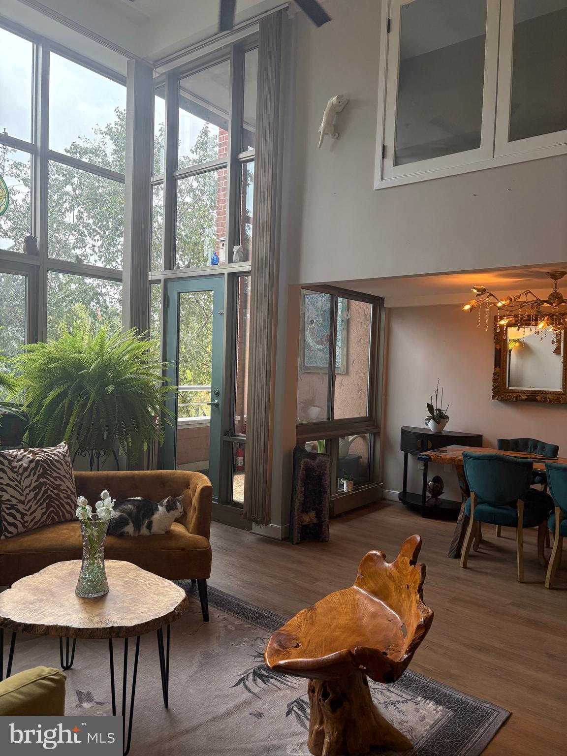 2901 Boston Street, Unit 206 Baltimore, MD 21224 - Photo 9 of 65 a living room with furniture and wooden floor