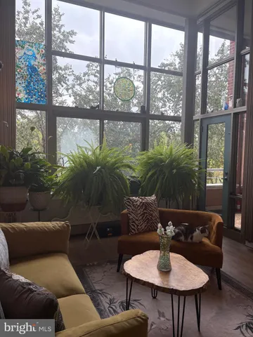 a workspace with furniture window and wooden floor