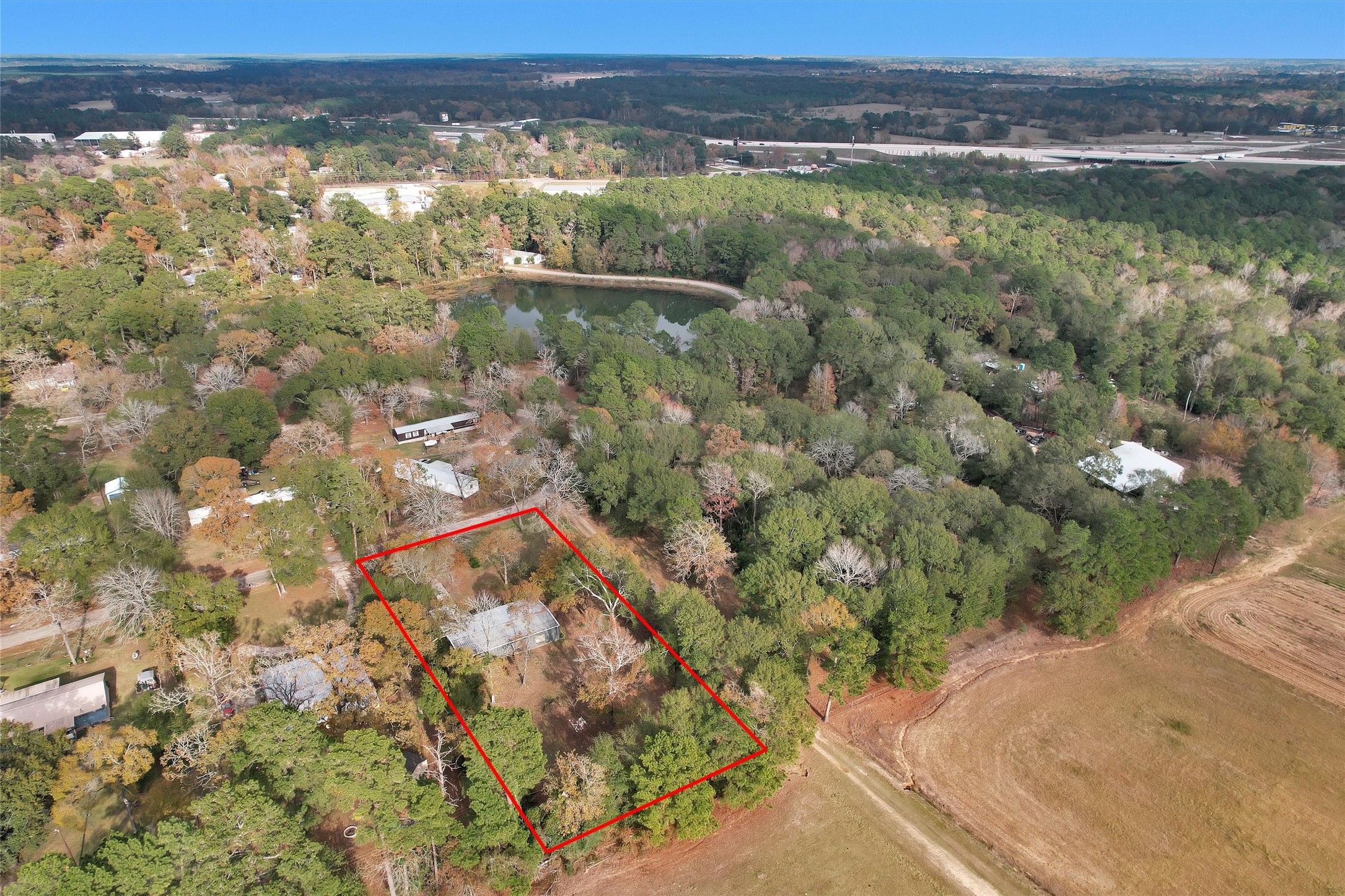 75 South Pavey Circle New Waverly, TX 77358 - Photo 2 of 21 a view of a lake from a yard
