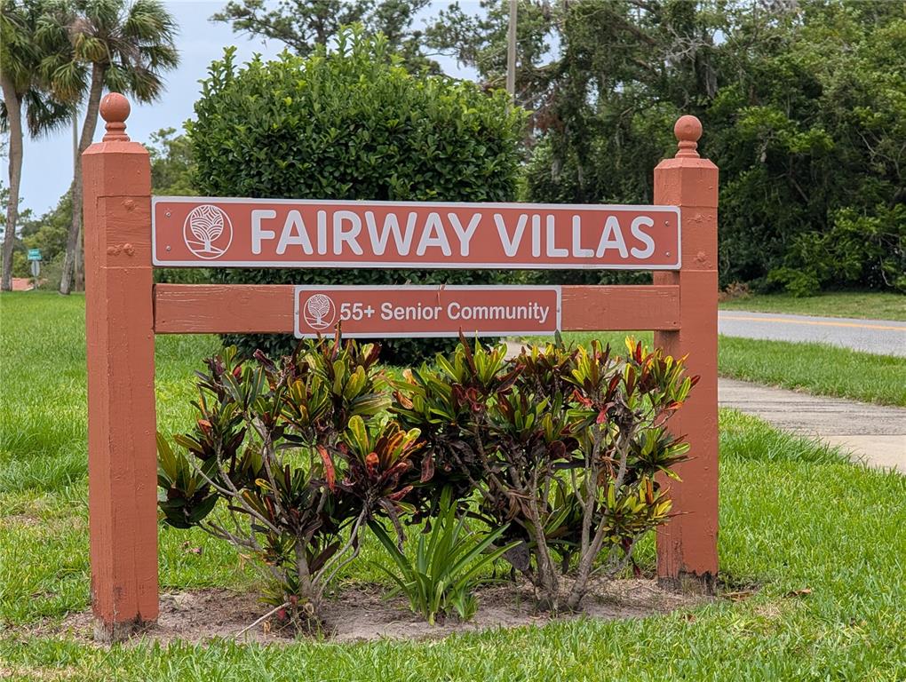8161 Braddock Circle, Unit 1 Port Richey, FL 34668 - Photo 25 of 27 a sign on the side of the road
