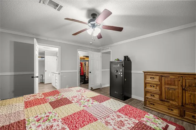 a bedroom with a bed and cabinets