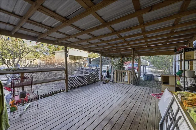 a view of a deck with wooden floor