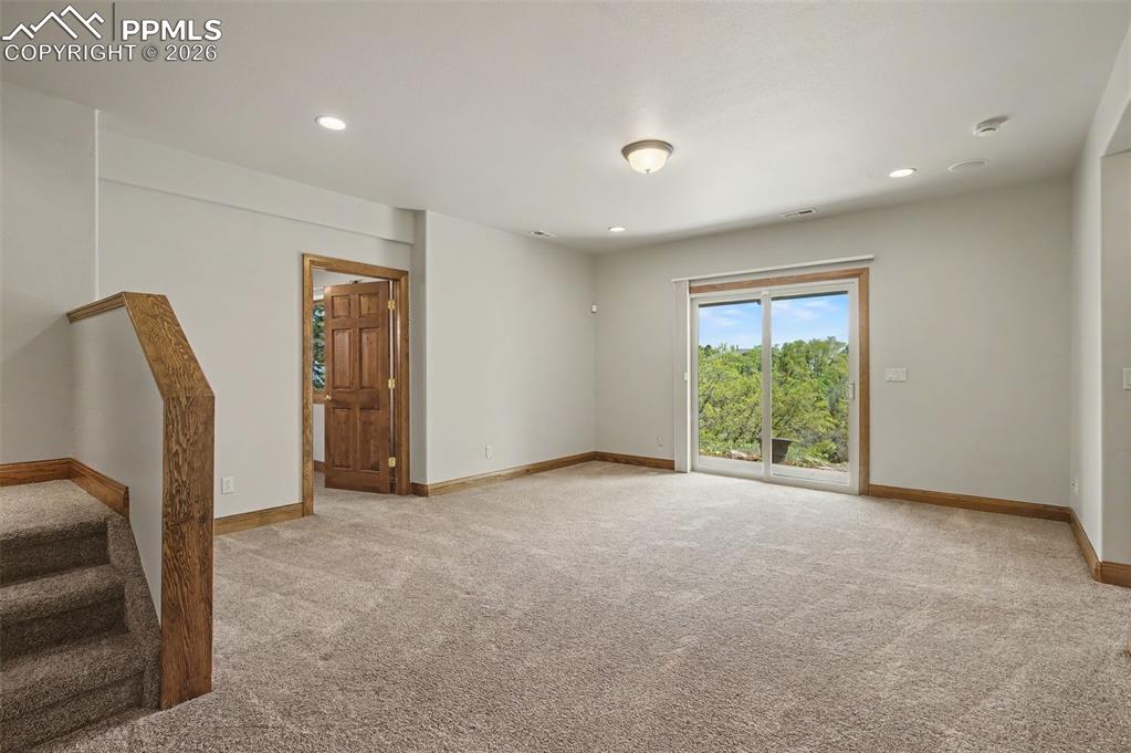4215 Star Ranch Road Colorado Springs, CO 80906 - Photo 30 of 44 a view of an empty room with a window
