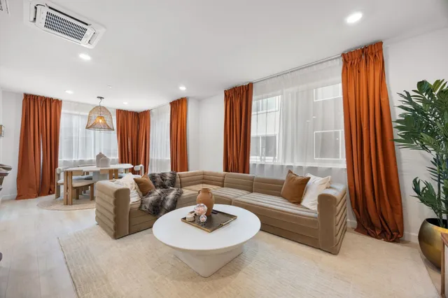 a kitchen that has a table and chairs in it