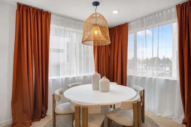 a view of a dining room with furniture window and outside view