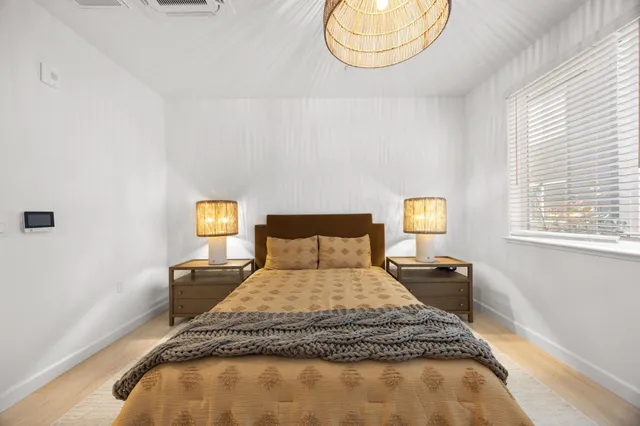 a view of a patio with a table and chairs under an umbrella