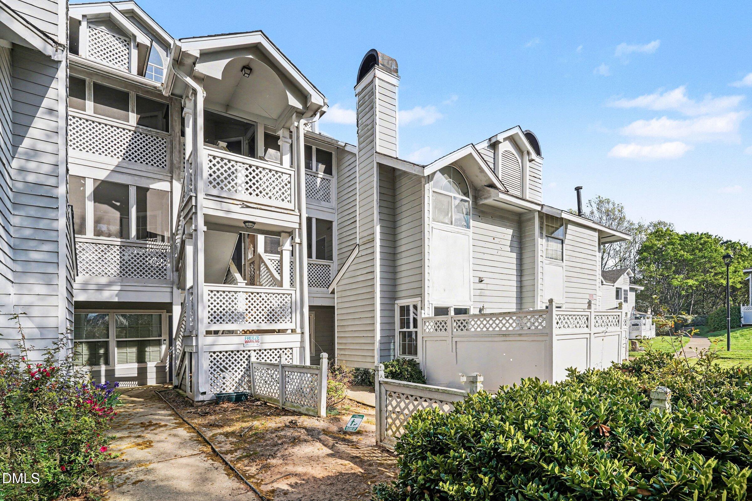 3806 Grey Harbor Drive, Unit 204 Raleigh, NC 27616 - Photo 1 of 18 a front view of a house with a yard