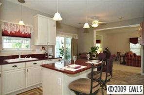 457 St George Road Fort Mill, SC 29708 - Photo 7 of 8 a kitchen with a dining table and chairs
