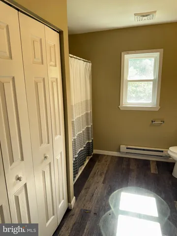 a view of front door with wooden floor