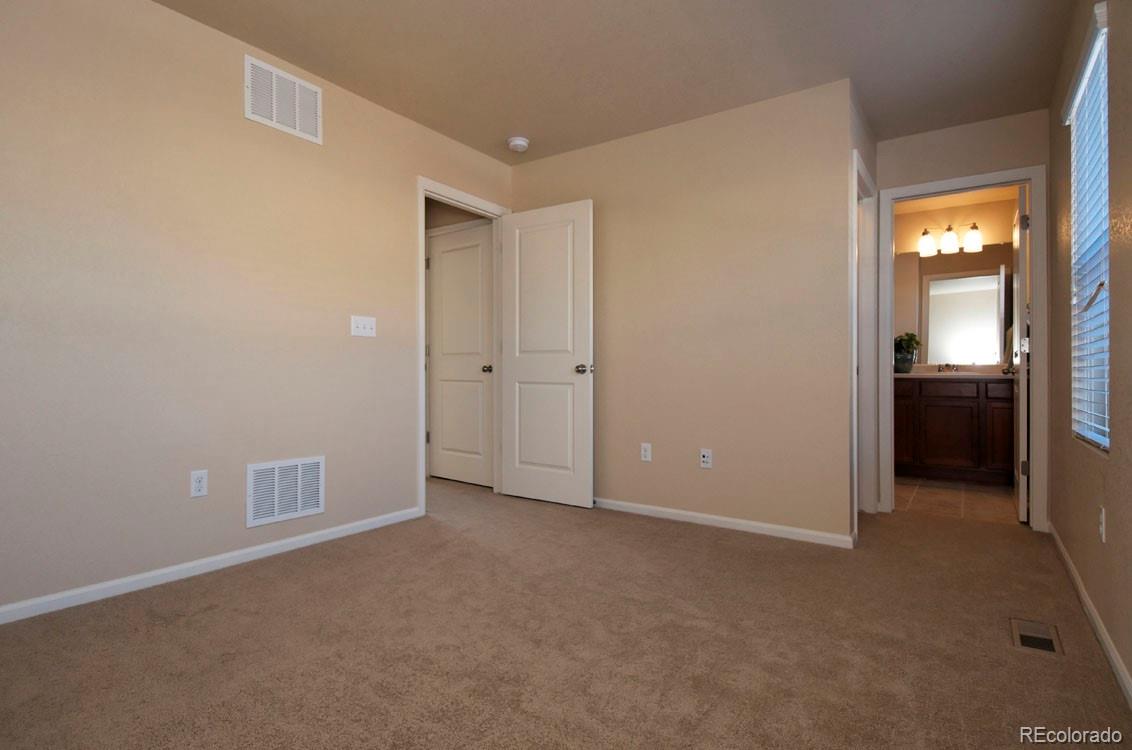 10296 Bellwether Lane Lone Tree, CO 80124 - Photo 14 of 29 an empty room with a bathroom