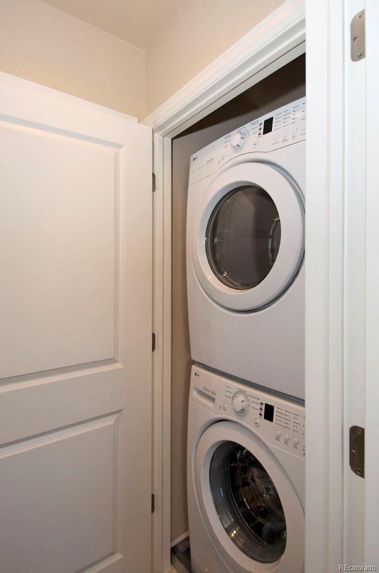 10296 Bellwether Lane Lone Tree, CO 80124 - Photo 21 of 29 a utility room with dryer and washer