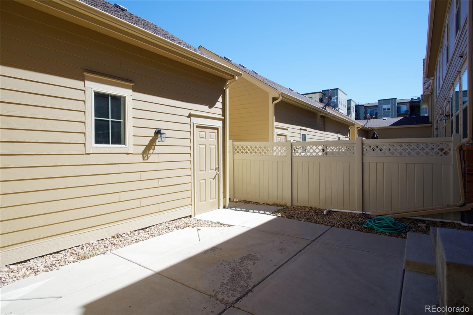 10296 Bellwether Lane Lone Tree, CO 80124 - Photo 22 of 29 a front view of a house with garage