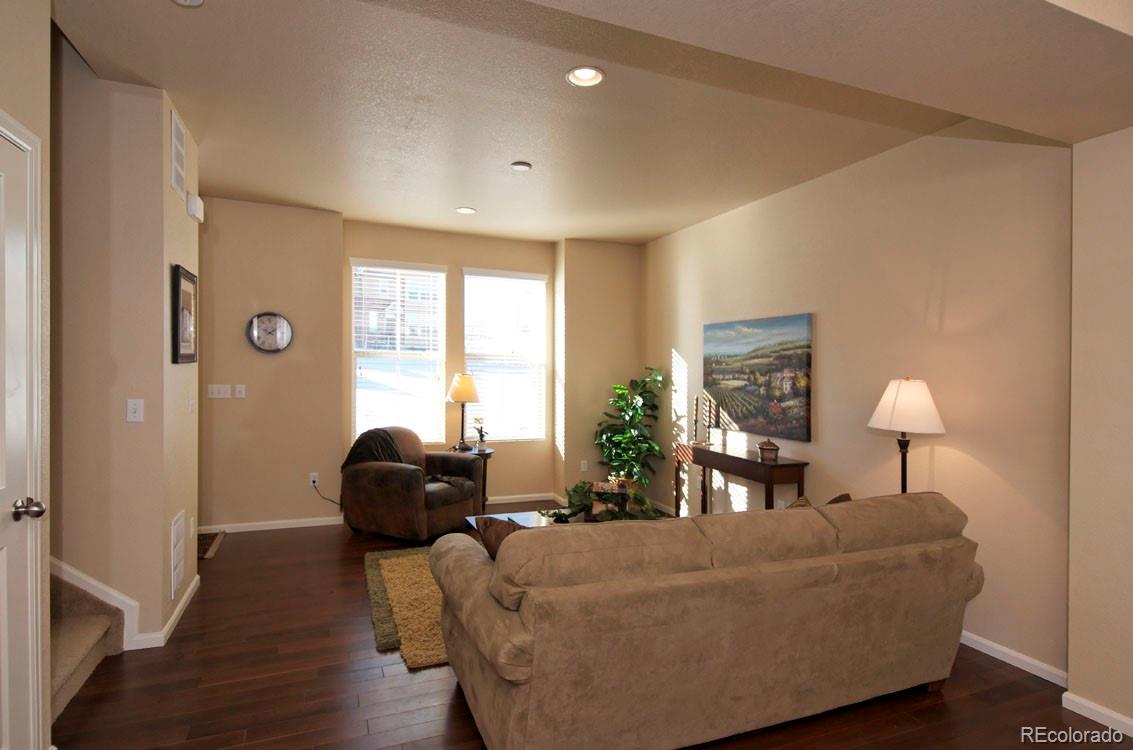 10296 Bellwether Lane Lone Tree, CO 80124 - Photo 3 of 29 a living room with furniture and a window