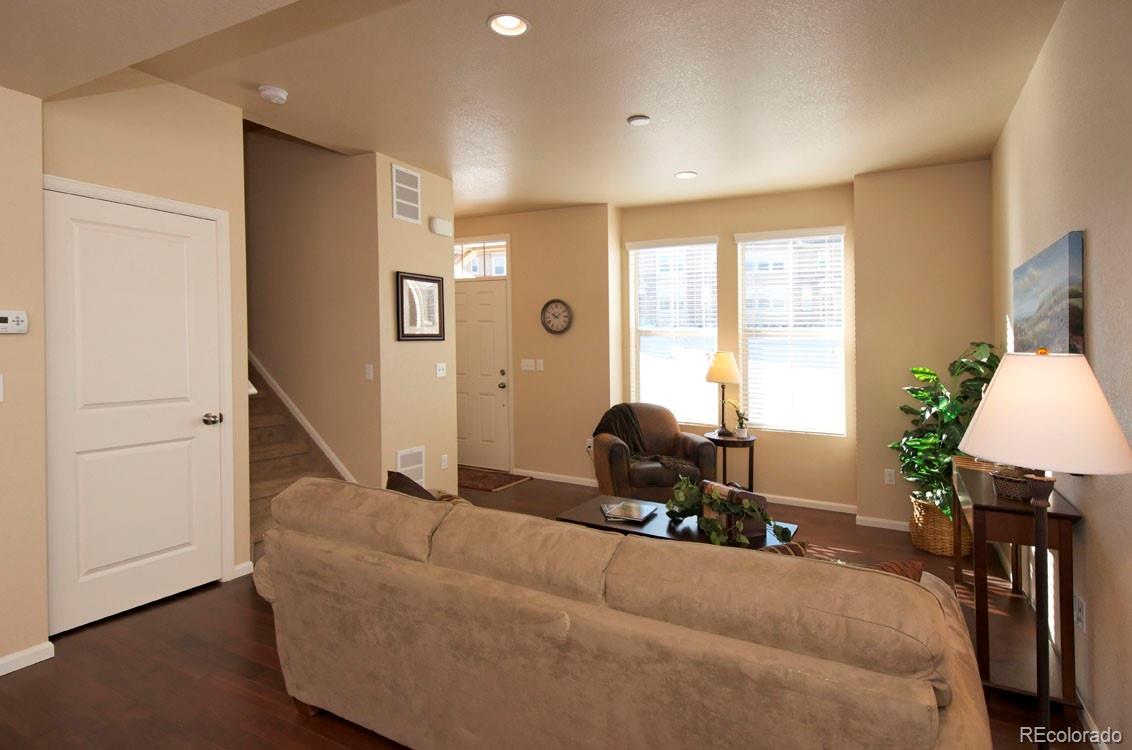 10296 Bellwether Lane Lone Tree, CO 80124 - Photo 4 of 29 a living room with furniture and a window
